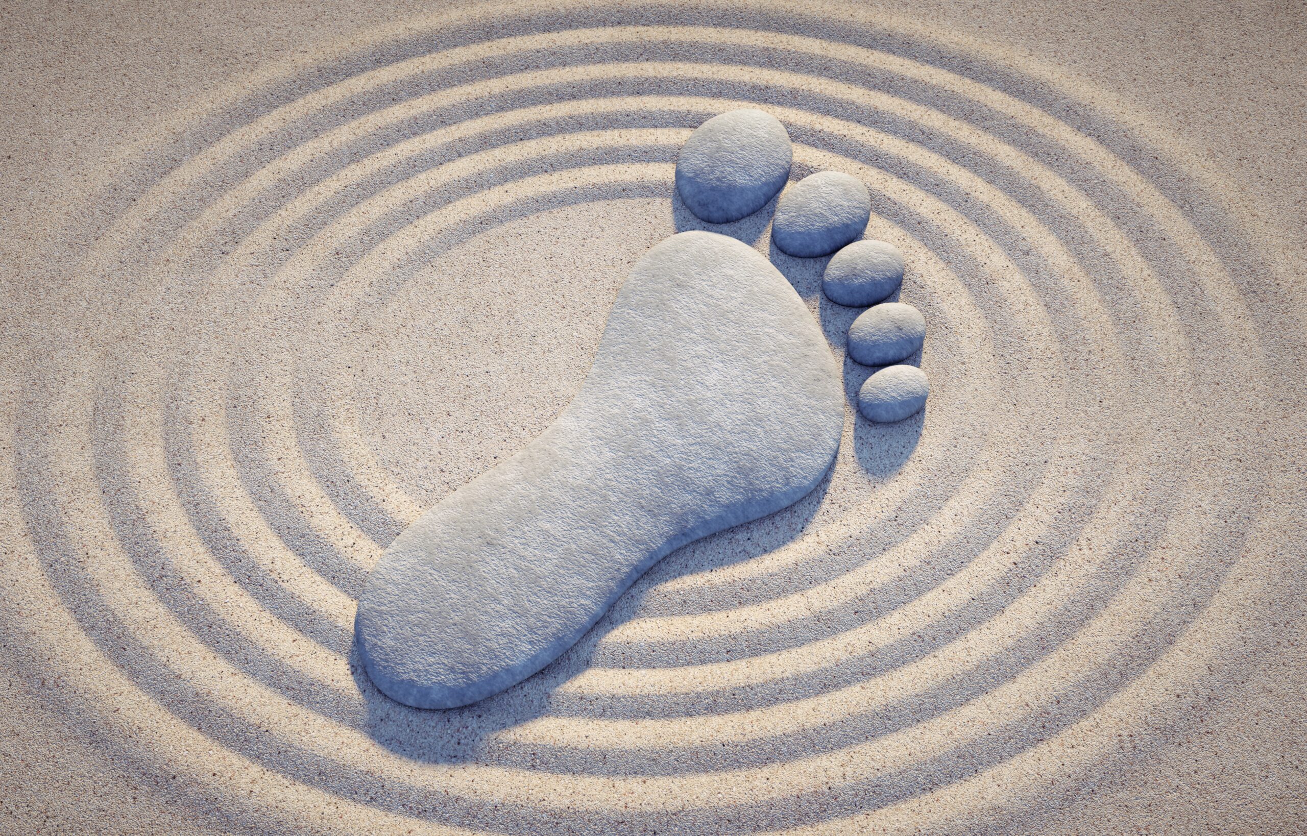 Stones,In,Shape,Of,A,Foot,With,Sand,Waves,-